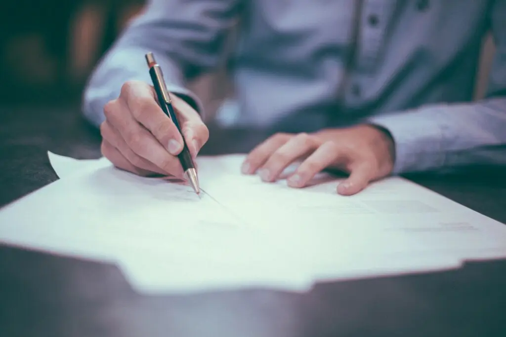 Business owner reviewing a revenue-based financing agreement with an advisor